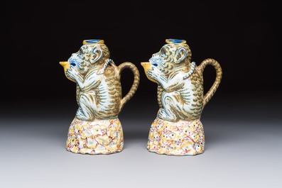 A pair of polychrome Dutch Delft monkey ewers and covers, 18th C.