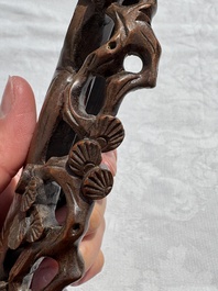 A Chinese carved red coral 'Birds and Flowers' group on a wooden stand, 19/20th C.