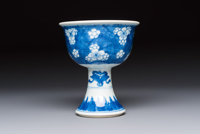 A Chinese blue and white 'Prunus on Cracked Ice' stem bowl, Kangxi