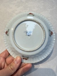 Seven Chinese famille verte cups and four saucers, conch shell and lingzhi marks, Kangxi
