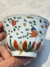 Seven Chinese famille verte cups and four saucers, conch shell and lingzhi marks, Kangxi