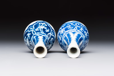 A Chinese blue and white covered vase and two bottle vases, Chenghua and jade marks, Kangxi