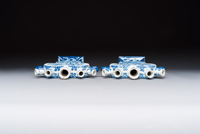 A pair of blue and white Dutch Delft tulip vases with a lady holding a cornucopia, 19th C.
