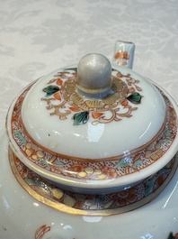 A Chinese famille verte teapot and three famille rose capucine-ground cups and saucers, Kangxi/Qianlong