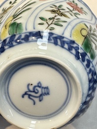 Seven Chinese famille verte cups and four saucers, conch shell and lingzhi marks, Kangxi