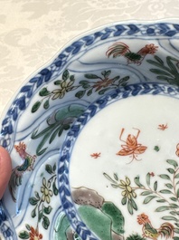 Seven Chinese famille verte cups and four saucers, conch shell and lingzhi marks, Kangxi