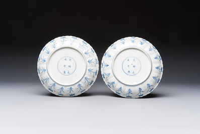 A pair of Chinese blue and white 'Hunting' plates, Chenghua marks, Kangxi