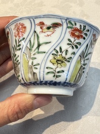 Seven Chinese famille verte cups and four saucers, conch shell and lingzhi marks, Kangxi