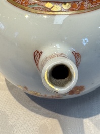A Chinese famille verte teapot and three famille rose capucine-ground cups and saucers, Kangxi/Qianlong