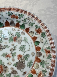 Seven Chinese famille verte cups and four saucers, conch shell and lingzhi marks, Kangxi