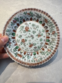 Seven Chinese famille verte cups and four saucers, conch shell and lingzhi marks, Kangxi