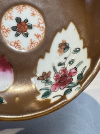 A Chinese famille verte teapot and three famille rose capucine-ground cups and saucers, Kangxi/Qianlong