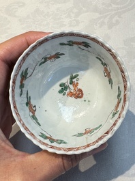 Seven Chinese famille verte cups and four saucers, conch shell and lingzhi marks, Kangxi