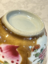 A Chinese famille verte teapot and three famille rose capucine-ground cups and saucers, Kangxi/Qianlong