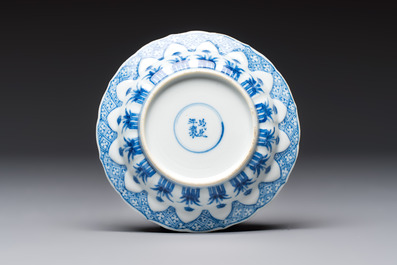 A Chinese blue and white 'Erotic Subject' saucer, Chenghua mark, Kangxi