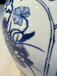 A Chinese blue and white 'Antiquities and Flower Baskets' vase with a wooden cover, Kangxi