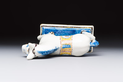 A polychrome Dutch Delft model of a standing horse with a figurative saddle cloth, 18th C.