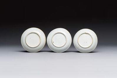 A Chinese famille verte teapot and three famille rose capucine-ground cups and saucers, Kangxi/Qianlong