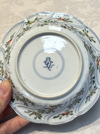 Seven Chinese famille verte cups and four saucers, conch shell and lingzhi marks, Kangxi