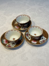 A Chinese famille verte teapot and three famille rose capucine-ground cups and saucers, Kangxi/Qianlong