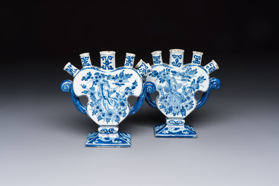 A pair of blue and white Dutch Delft tulip vases with a lady holding a cornucopia, 19th C.