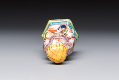 A polychrome Dutch Delft model of a seated oriental figure, 18th C.