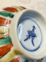 Seven Chinese famille verte cups and four saucers, conch shell and lingzhi marks, Kangxi