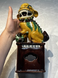 A pair of Chinese sancai-glazed Buddhist lions, Kangxi mark, 19th C.