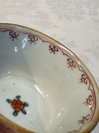 A Chinese famille verte teapot and three famille rose capucine-ground cups and saucers, Kangxi/Qianlong