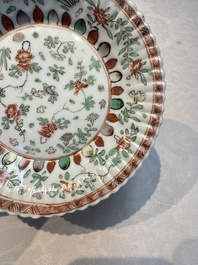 Seven Chinese famille verte cups and four saucers, conch shell and lingzhi marks, Kangxi