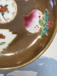 A Chinese famille verte teapot and three famille rose capucine-ground cups and saucers, Kangxi/Qianlong