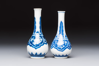 A Chinese blue and white covered vase and two bottle vases, Chenghua and jade marks, Kangxi