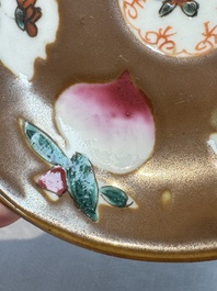 A Chinese famille verte teapot and three famille rose capucine-ground cups and saucers, Kangxi/Qianlong