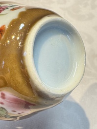 A Chinese famille verte teapot and three famille rose capucine-ground cups and saucers, Kangxi/Qianlong