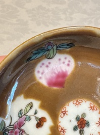 A Chinese famille verte teapot and three famille rose capucine-ground cups and saucers, Kangxi/Qianlong