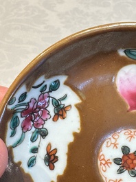 A Chinese famille verte teapot and three famille rose capucine-ground cups and saucers, Kangxi/Qianlong