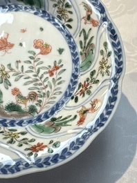 Seven Chinese famille verte cups and four saucers, conch shell and lingzhi marks, Kangxi