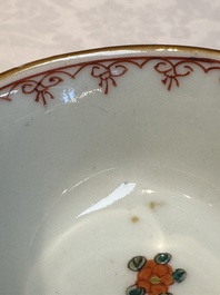 A Chinese famille verte teapot and three famille rose capucine-ground cups and saucers, Kangxi/Qianlong