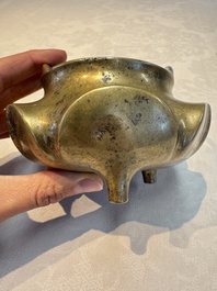 A Chinese bronze flower-shaped tripod censer with handles, Xuande mark, 19th C.