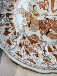 A pair of Chinese gilt iron-red-decorated 'Falconry' plates, Kangxi