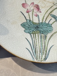 Four Chinese famille rose saucers and a gilt-decorated powder-blue-ground saucer, Qianlong and Jiaqing marks, 18/19th C.