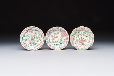 Three sets of Chinese famille verte cups and saucers with birds and flowers, various marks, Kangxi