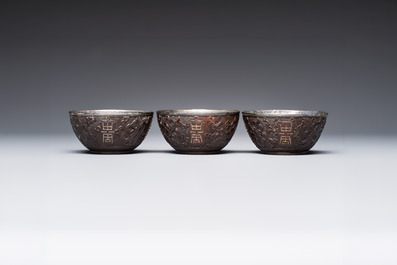 A group of 12 Chinese silver-lined coconut 'Shou 壽' bowls and cups, Wang Hengxin 王恆馨 marks, 19/20th C.
