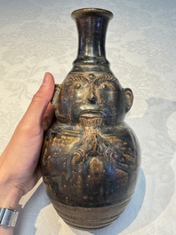 Three khmer-style brown-glazed anthropomorphic gourd-form bottles, probably 12/13th C.