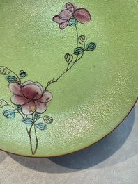 Four Chinese famille rose saucers and a gilt-decorated powder-blue-ground saucer, Qianlong and Jiaqing marks, 18/19th C.