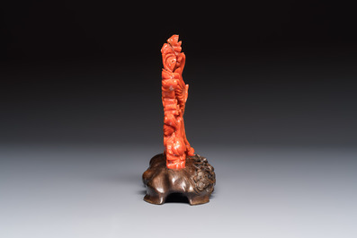 A Chinese carved red coral 'Birds and Flowers' group on a wooden stand, 19/20th C.