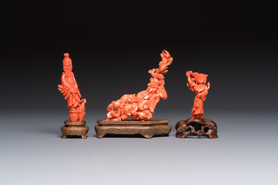 Three Chinese red coral carvings on wooden stands, 19/20th C.