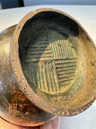 A miniature Chinese archaic bronze wine vessel with Taotie handles, 'Hu 壺', Han