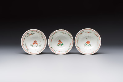 Seven Chinese famille verte cups and four saucers, conch shell and lingzhi marks, Kangxi