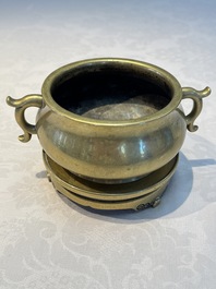 A Chinese bronze handled censer and stand, 17/18th C.